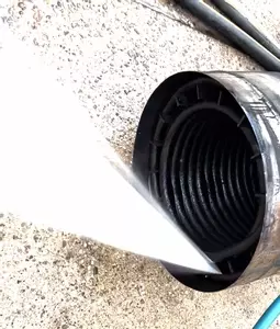Old burst heating coil from Nilfisk Contractor pressure washer being pressure tested to find the leak.
